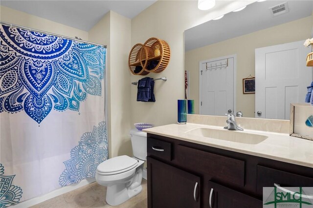 93 Bradford Pear Dr, Richmond Hill, GA 31324 - bathroom featuring toilet, vanity, tile patterned floors, and a shower with shower curtain
