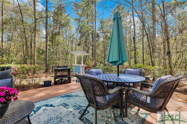 93 Bradford Pear Dr, Richmond Hill, GA 31324 - view of patio / terrace with outdoor dining space