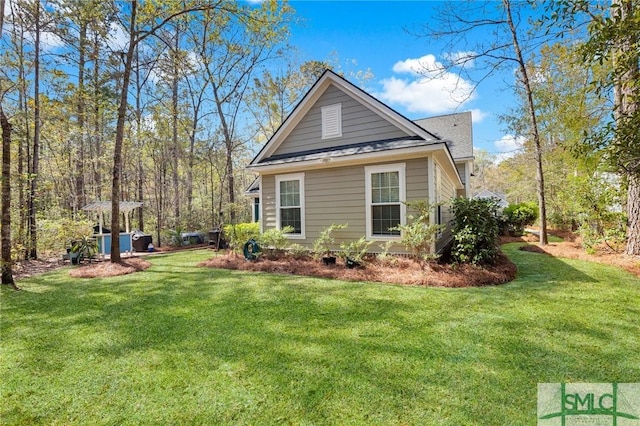 93 Bradford Pear Dr, Richmond Hill, GA 31324 - view of home's exterior featuring a lawn