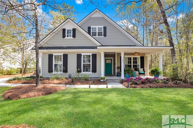 93 Bradford Pear Dr, Richmond Hill, GA 31324 - view of front of property with covered porch, a front yard, and a ceiling fan