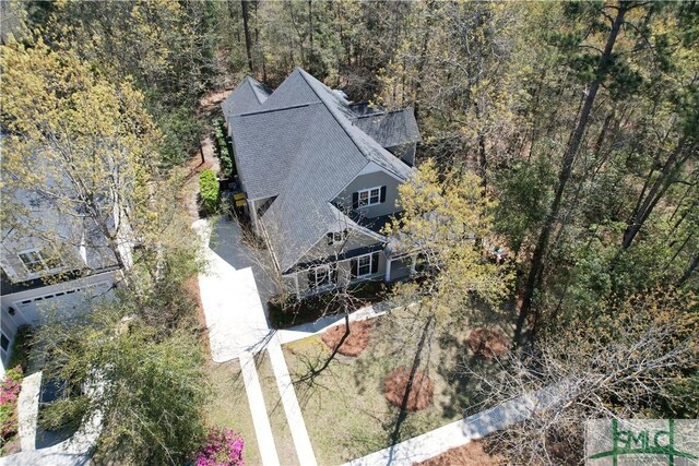 93 Bradford Pear Dr, Richmond Hill, GA 31324 - aerial view of property and surrounding area with a heavily wooded area