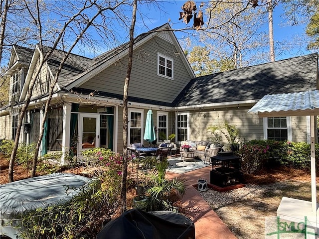 93 Bradford Pear Dr, Richmond Hill, GA 31324 - back of property with a patio area and outdoor lounge area
