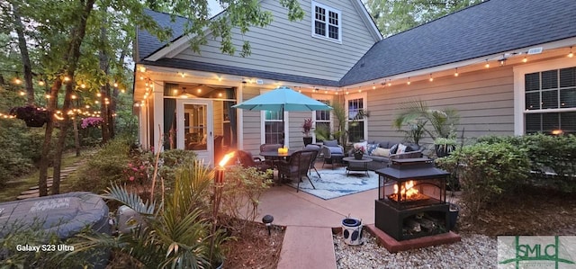 93 Bradford Pear Dr, Richmond Hill, GA 31324 - view of patio featuring an outdoor living space with a fire pit
