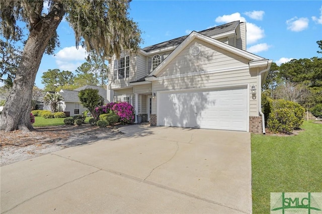 traditional-style home with brick siding, a front yard, driveway, and a garage