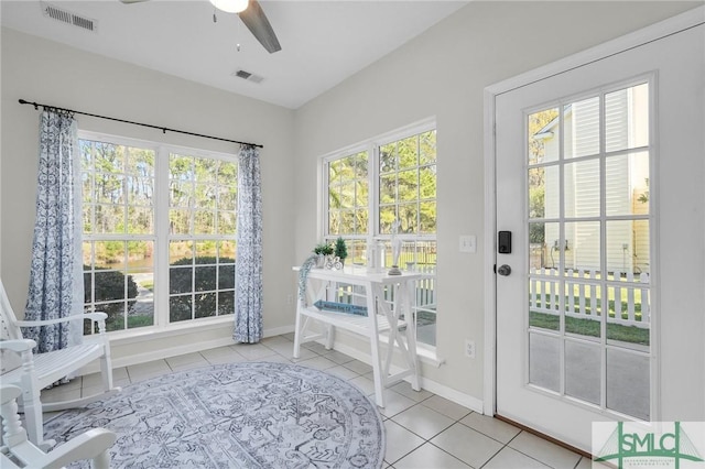 doorway to outside featuring visible vents, tile patterned floors, and a ceiling fan