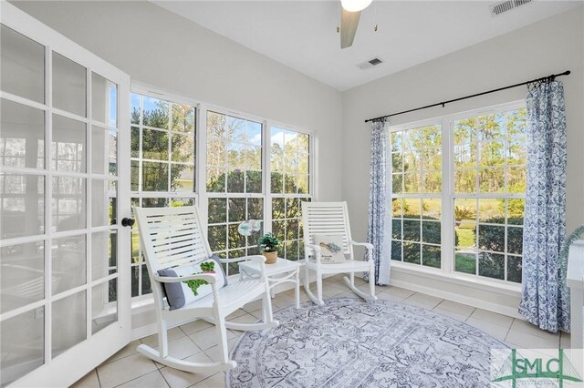 sunroom / solarium with ceiling fan and visible vents