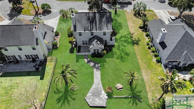 birds eye view of property with a residential view