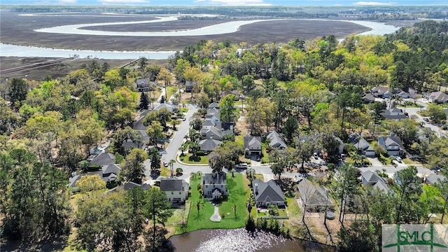 drone / aerial view featuring a residential view and a water view