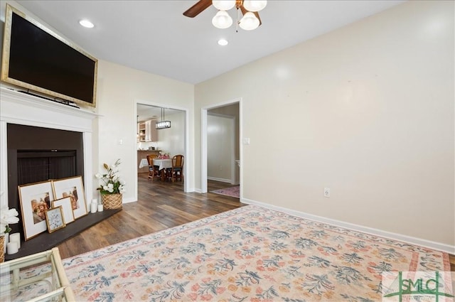 bedroom with recessed lighting, baseboards, and wood finished floors