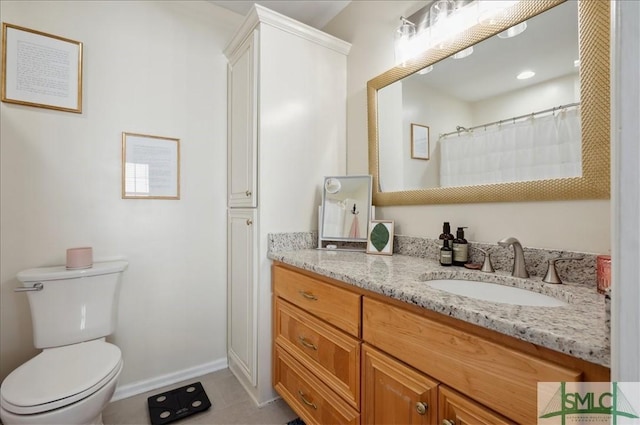 full bath with toilet, vanity, baseboards, and tile patterned flooring