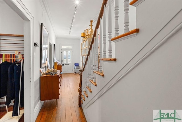 24 W Taylor St, Savannah, GA 31401 - hallway featuring crown molding, track lighting, stairs, and wood-type flooring