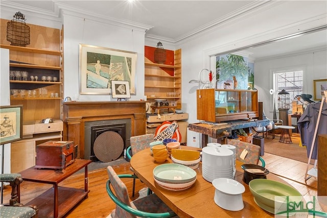 24 W Taylor St, Savannah, GA 31401 - sitting room with a fireplace with flush hearth, crown molding, and hardwood / wood-style flooring