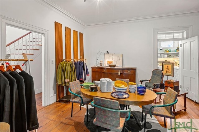 24 W Taylor St, Savannah, GA 31401 - dining area featuring stairway, crown molding, and light wood finished floors
