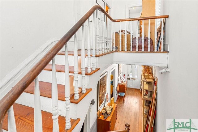 24 W Taylor St, Savannah, GA 31401 - staircase with hardwood / wood-style flooring