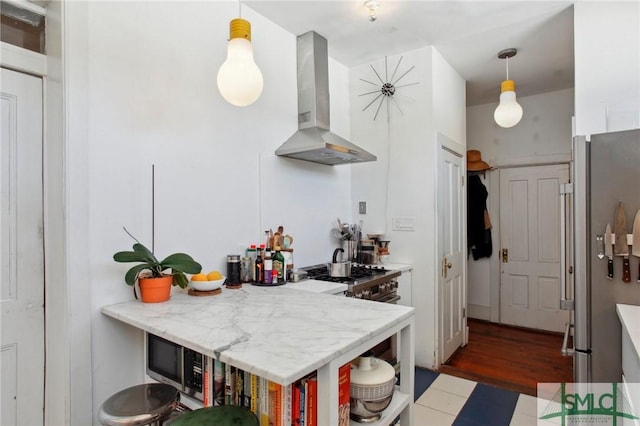 24 W Taylor St, Savannah, GA 31401 - kitchen featuring stainless steel appliances, open shelves, wall chimney range hood, light tile patterned flooring, and hanging light fixtures