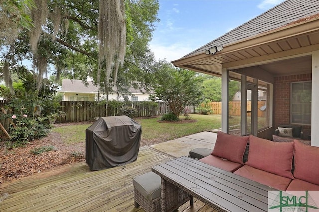 wooden terrace featuring a grill and an outdoor hangout area