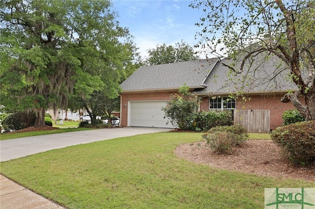 view of front of property with brick siding, a front yard, a garage, and concrete driveway