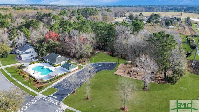 aerial view of property's location featuring a pool area