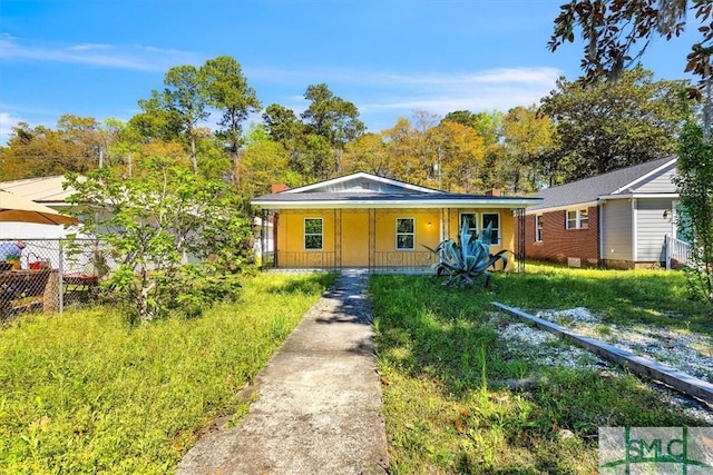 bungalow-style home with fence and a porch