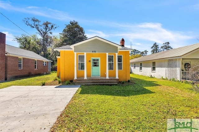 bungalow-style house featuring a front yard