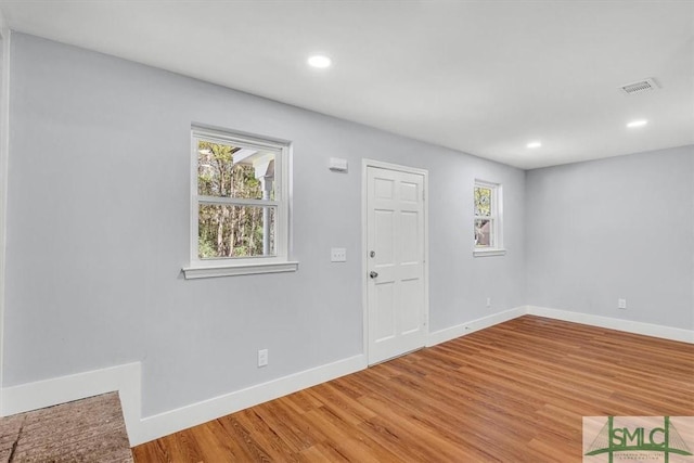 foyer entrance with recessed lighting, baseboards, and light wood-type flooring