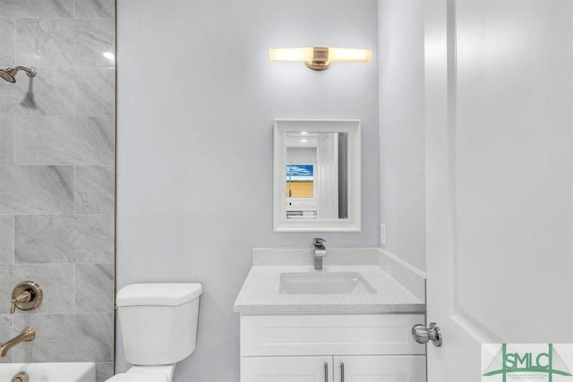 full bath featuring bathtub / shower combination, toilet, and vanity