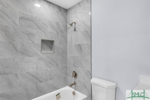 bathroom with toilet and shower / tub combination