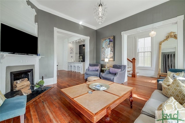 909 Howard St, Savannah, GA 31401 - living area with ornamental molding, a fireplace, and wood finished floors
