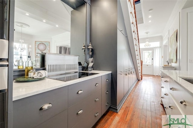 909 Howard St, Savannah, GA 31401 - bathroom with recessed lighting, ornamental molding, and hardwood / wood-style flooring