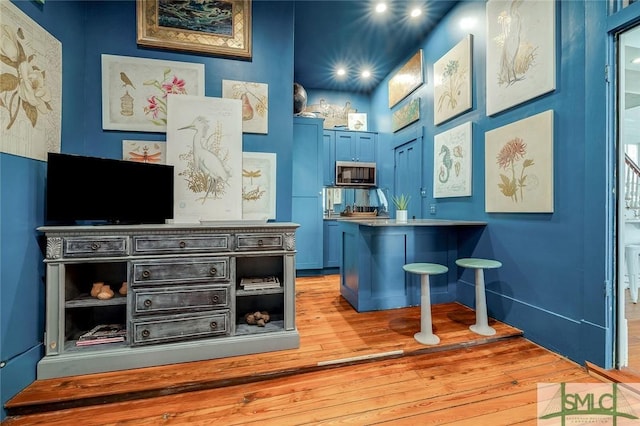 909 Howard St, Savannah, GA 31401 - bar featuring stainless steel microwave and light wood finished floors