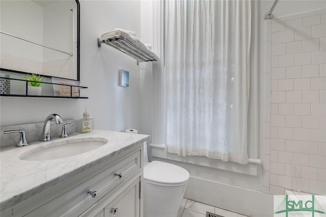 909 Howard St, Savannah, GA 31401 - bathroom featuring shower / bath combo, toilet, and vanity
