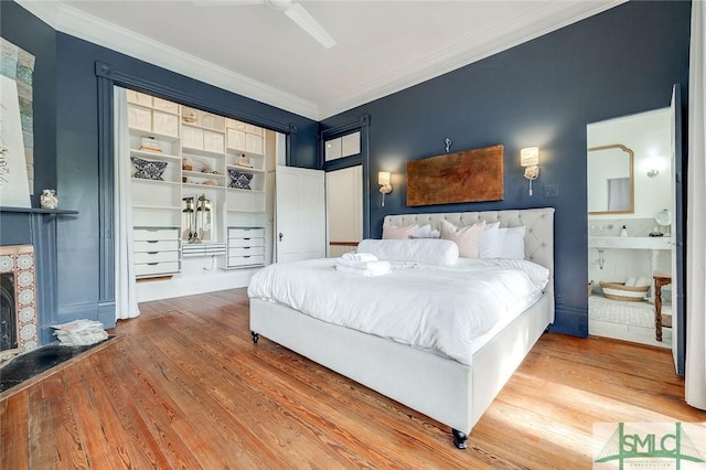 909 Howard St, Savannah, GA 31401 - bedroom with a ceiling fan, crown molding, a fireplace, and wood finished floors