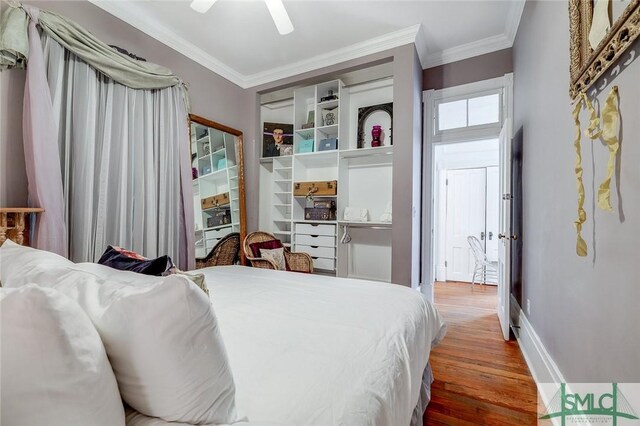 909 Howard St, Savannah, GA 31401 - bedroom featuring baseboards, a ceiling fan, wood finished floors, and crown molding