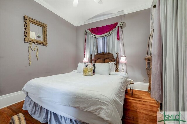 909 Howard St, Savannah, GA 31401 - bedroom featuring ornamental molding, baseboards, ceiling fan, and wood finished floors