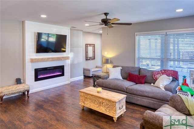 living room with a ceiling fan, recessed lighting, baseboards, wood finished floors, and a fireplace