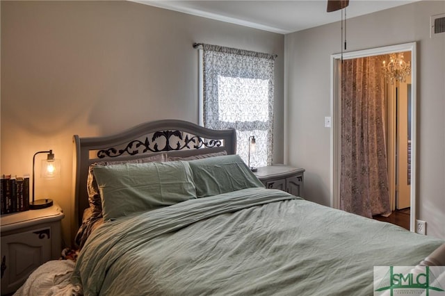 bedroom featuring visible vents
