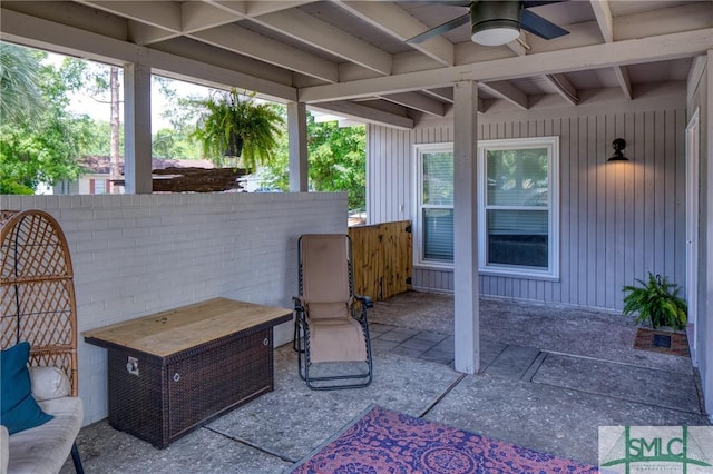 view of patio featuring fence and a ceiling fan