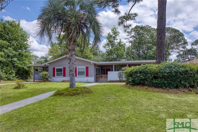 single story home featuring a front lawn