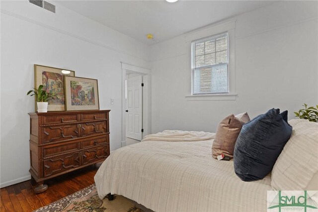306 E Victory Dr, Savannah, GA 31405 - bedroom featuring wood finished floors, visible vents, and baseboards