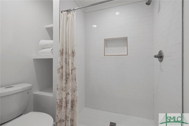 306 E Victory Dr, Savannah, GA 31405 - bathroom featuring a shower stall and toilet