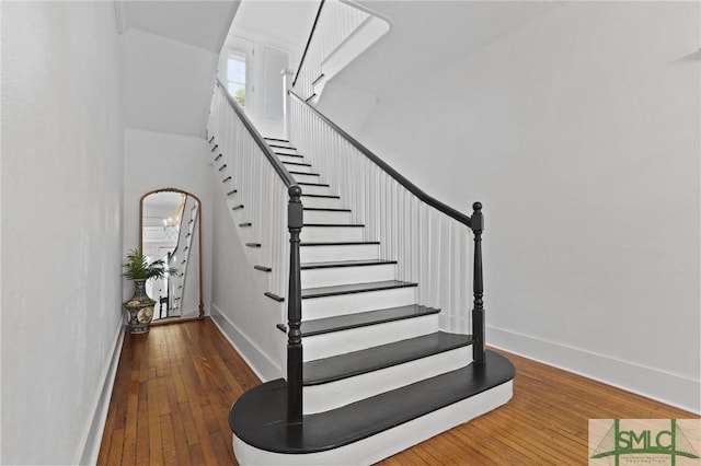 306 E Victory Dr, Savannah, GA 31405 - staircase with hardwood / wood-style flooring and baseboards