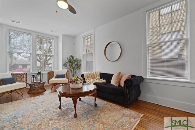 306 E Victory Dr, Savannah, GA 31405 - living area with a ceiling fan, wood finished floors, and visible vents