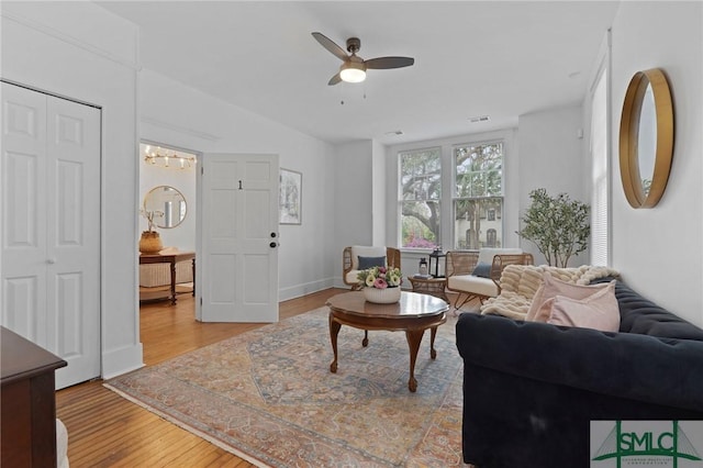 306 E Victory Dr, Savannah, GA 31405 - living room featuring visible vents, baseboards, lofted ceiling, a ceiling fan, and wood finished floors