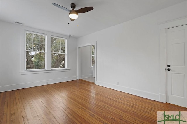 306 E Victory Dr, Savannah, GA 31405 - spare room featuring ceiling fan, baseboards, hardwood / wood-style floors, and visible vents