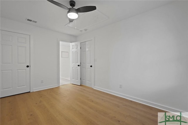 306 E Victory Dr, Savannah, GA 31405 - unfurnished bedroom with attic access, baseboards, visible vents, and light wood-type flooring