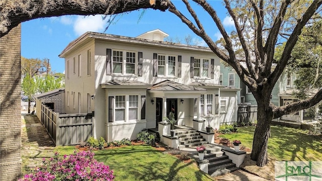306 E Victory Dr, Savannah, GA 31405 - american foursquare style home featuring a front yard and fence