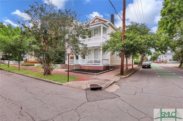 420 E Bolton St, Savannah, GA 31401 - view of front of property with a balcony and a chimney
