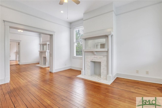 420 E Bolton St, Savannah, GA 31401 - unfurnished living room with a fireplace with flush hearth, ceiling fan, baseboards, and hardwood / wood-style flooring