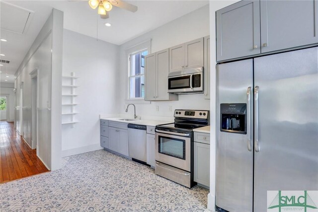 420 E Bolton St, Savannah, GA 31401 - kitchen featuring stainless steel appliances, a sink, a ceiling fan, and gray cabinets