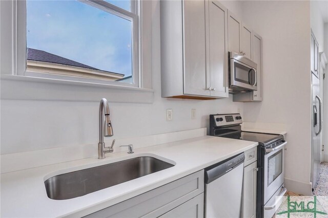 420 E Bolton St, Savannah, GA 31401 - kitchen with light countertops, a sink, and stainless steel appliances